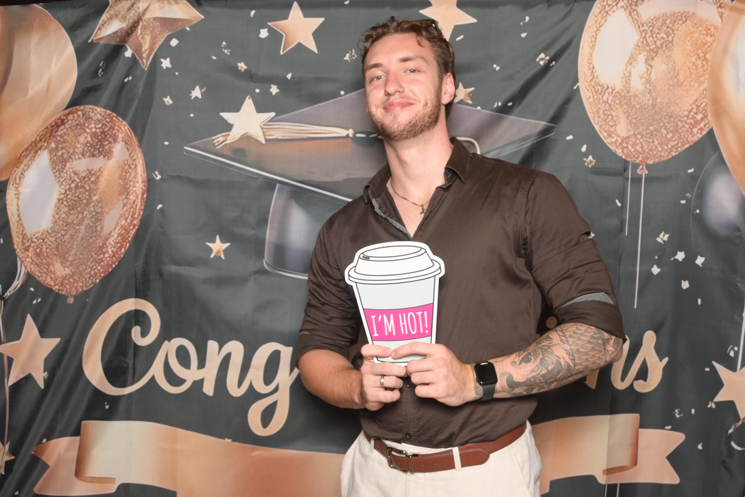 Students posing at the graduation photo booth